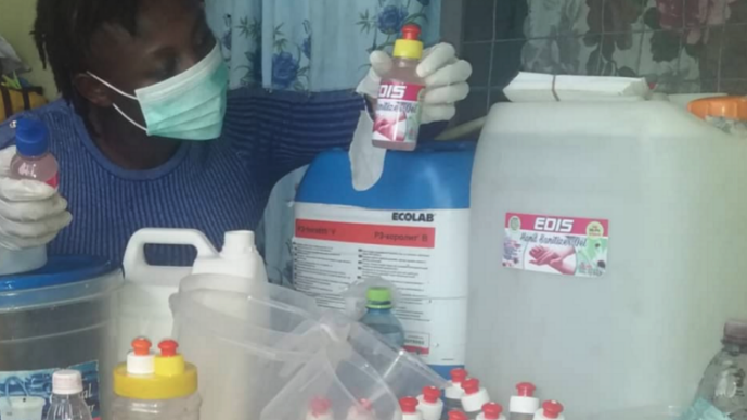 Picture of woman who is local producer of hand sanitiser in Ghana